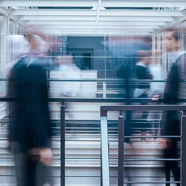 business-people-talking-in-corridor-PSVCLEM(1)